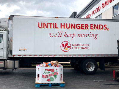 Maryland Food Bank truck and pallet of donated food.