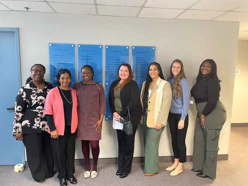 Seven women lined up after a volunteer event